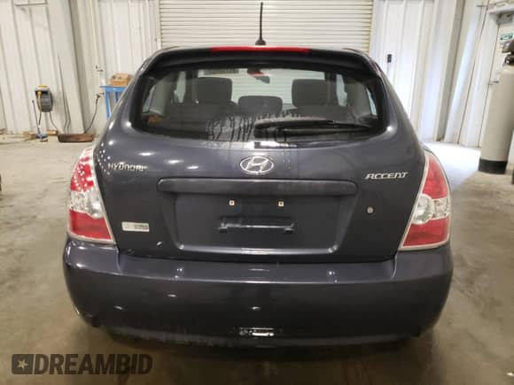 2010 Hyundai Accent SE with VIN KMHCN3AC5AU154590, listed as a Copart auction lot 85150054 with 115,376 mi miles and Salvage title. Bid and sale history available at DreamBid. Image 6.