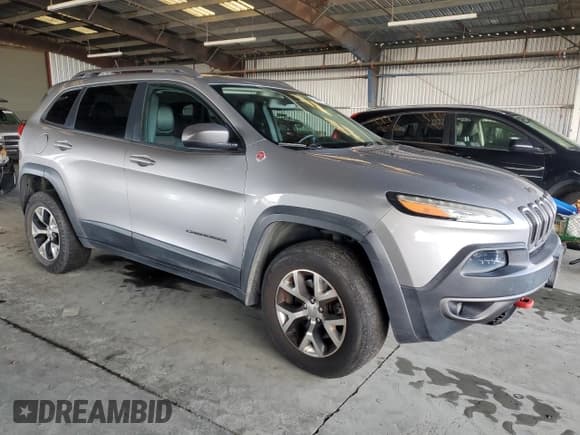 ✅ 2014 Jeep Cherokee Trailhawk • VIN: 1C4PJMBS0EW257312 • Lot: 93487845. Listed on Copart with 143,122 mi. Free auction sales archive from the USA and detailed vehicle history report at DreamBid. Image 4.