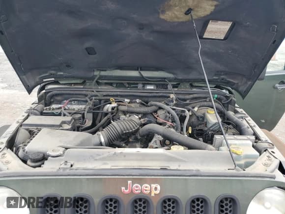 ✅ 2007 Jeep Wrangler Unlimited Sahara • VIN: 1J4GA59197L161289 • Лот: 67546555. Опубликован ранее на Copart с пробегом 198 630 миль. Бесплатный доступ к архиву аукционных продаж из США и подробный отчёт об истории автомобиля на DreamBid. Изображение 11.