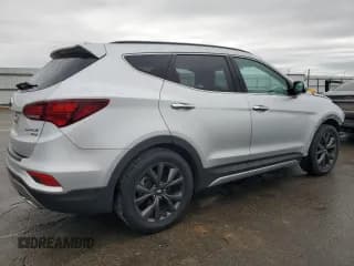 ✅ 2018 Hyundai Santa Fe Ultimate • VIN: 5XYZW4LA2JG507009 • Лот: 38081144. Опубликован ранее на Copart с пробегом 54 255 миль. Бесплатный доступ к архиву аукционных продаж из США и подробный отчёт об истории автомобиля на DreamBid. Изображение 3.