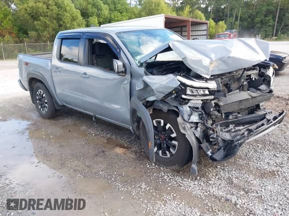 2022 Nissan Frontier Pro-4X z VIN 1N6ED1EK0NN620249, wystawiony jako IAAI lot #43387462 z przebiegiem 92 659 mil mil oraz . Historia ofert i sprzedaży dostępna na DreamBid. Obrazek 1.