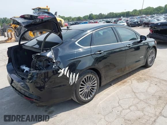 ✅ 2017 Ford Fusion Hybrid Titanium • VIN: 3FA6P0RU2HR360481 • Лот: 42902061. Опубликован ранее на IAAI с пробегом 88 086 миль. Бесплатный доступ к архиву аукционных продаж из США и подробный отчёт об истории автомобиля на DreamBid. Изображение 4.