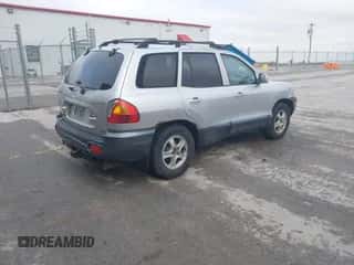 2001 Hyundai Santa Fe GLS z VIN KM8SC83DX1U054408, wystawiony jako IAAI lot #41498025 z przebiegiem 159 366 mil mil oraz . Historia ofert i sprzedaży dostępna na DreamBid. Obrazek 4.