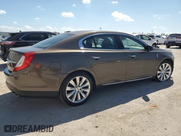 ✅ 2015 Lincoln MKS EcoBoost • VIN: 1LNHL9FT0FG602960 • Lot: 47478715. Wystawiony na Copart z przebiegiem 94 781 mil. Bezpłatny archiwum sprzedaży aukcyjnych z USA i szczegółowy raport historii pojazdu na DreamBid. Zdjęcie 3.