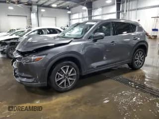 ✅ 2018 Mazda CX-5 Grand Touring • VIN: JM3KFBDMXJ0385933 • Lot: 89535235. Wystawiony na Copart z przebiegiem 86 081 mil. Bezpłatny archiwum sprzedaży aukcyjnych z USA i szczegółowy raport historii pojazdu na DreamBid. Zdjęcie 1.