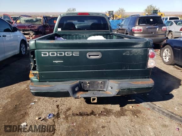 1999 Dodge Dakota SLT z VIN 1B7GG22X0XS239398, wystawiony jako Copart lot #80143414 z przebiegiem 147 646 mil mil oraz Szkoda całkowita • Salvage title. Historia ofert i sprzedaży dostępna na DreamBid. Obrazek 6.