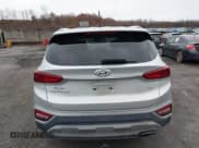 ✅ 2019 Hyundai Santa Fe SE • VIN: 5NMS2CAD7KH054274 • Lot: 43694931. Listed on IAAI with 96,329 mi. Free auction sales archive from the USA and detailed vehicle history report at DreamBid. Image 16.