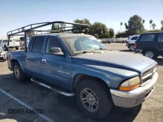 2002 Dodge Dakota SLT z VIN 1B7HL48N52S632677, wystawiony jako Copart lot #76509804 z przebiegiem 241 947 mil mil oraz Szkoda całkowita • Salvage title. Historia ofert i sprzedaży dostępna na DreamBid. Obrazek 4.