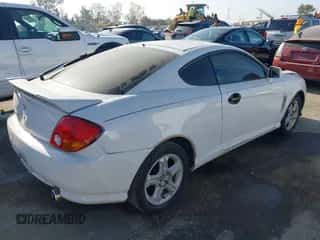 2004 Hyundai Tiburon GS с VIN KMHHM65D64U107599, выставлен на аукционе IAAI как лот 42895093 с пробегом 184 234 миль миль и . История ставок и продаж доступна на DreamBid. Изображение 4.