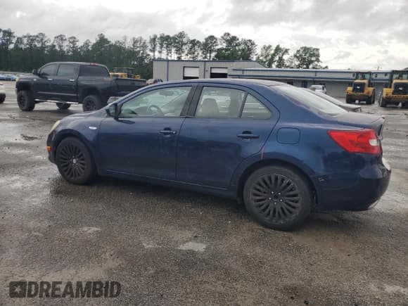 ✅ 2012 Suzuki Kizashi SE • VIN: JS2RE9A36C6100178 • Lot: 54519445. Listed on Copart with 103,342 mi. Free auction sales archive from the USA and detailed vehicle history report at DreamBid. Image 2.