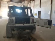 ✅ 2004 Jeep Wrangler Rubicon • VIN: 1J4FA69S14P758371 • Lot: 85557875. Wystawiony na Copart z przebiegiem 144 656 mil. Bezpłatny archiwum sprzedaży aukcyjnych z USA i szczegółowy raport historii pojazdu na DreamBid. Zdjęcie 6.