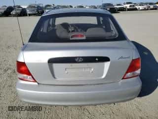 2002 Hyundai Accent with VIN KMHCF35G62U203274, listed as a Copart auction lot 77047834 with 90,442 mi miles and Salvage title. Bid and sale history available at DreamBid. Image 6.