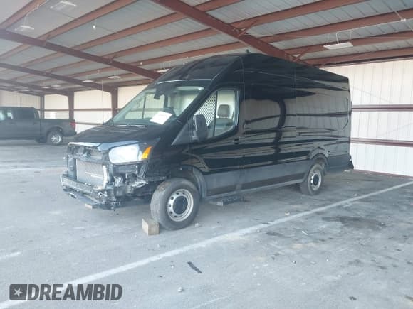 ✅ 2021 Ford Transit Cargo • VIN: 1FTBR3XG8MKA89703 • Lot: 42885214. Listed on IAAI with 79,907 mi. Free auction sales archive from the USA and detailed vehicle history report at DreamBid. Image 2.
