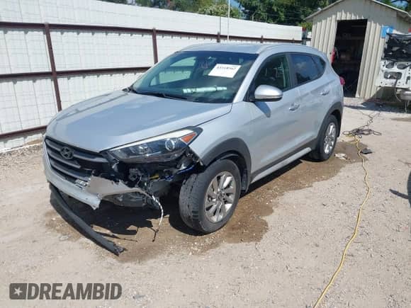 2018 Hyundai Tucson SEL z VIN KM8J33A41JU695772, wystawiony jako IAAI lot #43318562 z przebiegiem 104 982 mil mil oraz . Historia ofert i sprzedaży dostępna na DreamBid. Obrazek 2.