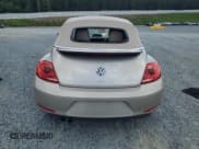 ✅ 2015 Volkswagen Beetle • VIN: 3VW5A7AT9FM815899 • Lot: 63074125. Listed on Copart with 77,214 mi. Free auction sales archive from the USA and detailed vehicle history report at DreamBid. Image 6.