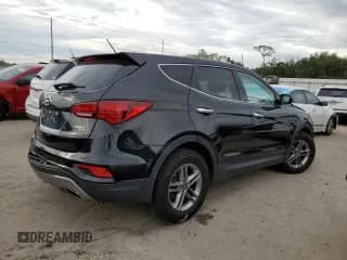 ✅ 2018 Hyundai Santa Fe 2.4L • VIN: 5NMZTDLB3JH077563 • Лот: 65330622. Опубликован ранее на Copart с пробегом 65 169 миль. Бесплатный доступ к архиву аукционных продаж из США и подробный отчёт об истории автомобиля на DreamBid. Изображение 3.
