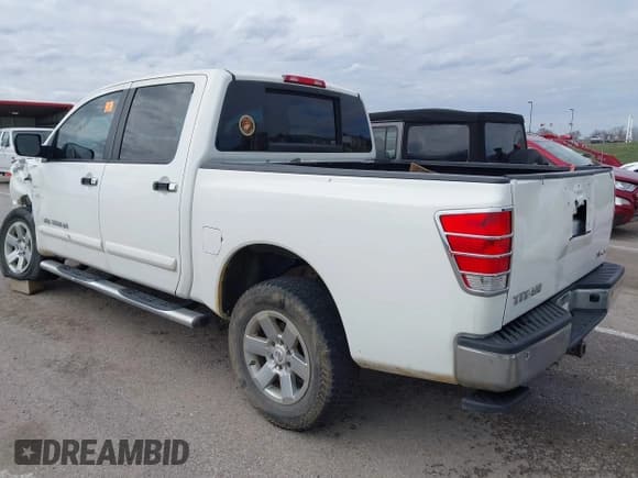 ✅ 2011 Nissan Titan SL • VIN: 1N6AA0EC7BN313599 • Lot: 41888934. Listed on IAAI with 182,894 mi. Free auction sales archive from the USA and detailed vehicle history report at DreamBid. Image 3.