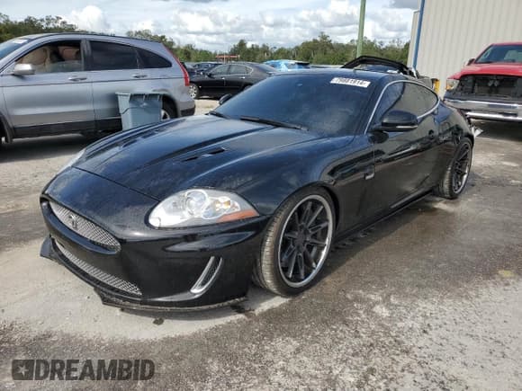 ✅ 2011 Jaguar XK XKR • VIN: SAJWA4DCXBMB39622 • Lot: 79881914. Listed on Copart with 61,163 mi. Free auction sales archive from the USA and detailed vehicle history report at DreamBid. Image 1.