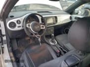 ✅ 2014 Volkswagen Beetle 1.8T • VIN: 3VWJ17AT7EM659875 • Lot: 95826185. Listed on Copart with 108,214 mi. Free auction sales archive from the USA and detailed vehicle history report at DreamBid. Image 8.