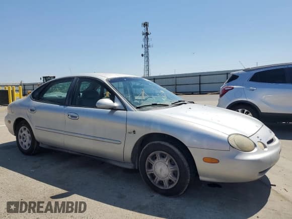 ✅ 1997 Ford Taurus GL • VIN: 1FALP5228VG222228 • Lot: 64806845. Listed on Copart with 160,397 mi. Free auction sales archive from the USA and detailed vehicle history report at DreamBid. Image 4.