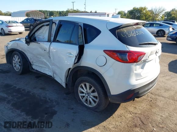 ✅ 2014 Mazda CX-5 Touring • VIN: JM3KE4CY4E0331665 • Лот: 43160091. Опубликован ранее на IAAI с пробегом Не указан. Бесплатный доступ к архиву аукционных продаж из США и подробный отчёт об истории автомобиля на DreamBid. Изображение 3.