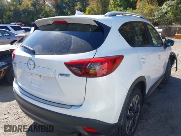 ✅ 2016 Mazda CX-5 Grand Touring • VIN: JM3KE4DY8G0908425 • Lot: 43350691. Wystawiony na IAAI z przebiegiem 144 684 mil. Bezpłatny archiwum sprzedaży aukcyjnych z USA i szczegółowy raport historii pojazdu na DreamBid. Zdjęcie 4.