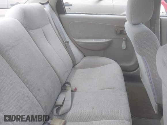 ✅ 2003 Kia Spectra • VIN: KNAFB121535246949 • Lot: 42402307. Listed on IAAI with 98,678 mi. Free auction sales archive from the USA and detailed vehicle history report at DreamBid. Image 8.