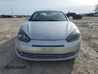 2008 Hyundai Tiburon GS z VIN KMHHM66D68U296212, wystawiony jako Copart lot #88536725 z przebiegiem 116 240 mil mil oraz Szkoda całkowita • Salvage title. Historia ofert i sprzedaży dostępna na DreamBid. Obrazek 5.
