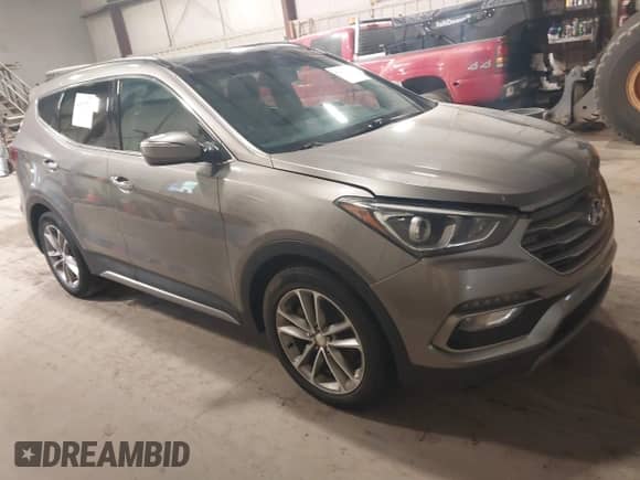 2017 Hyundai Santa Fe 2.0T z VIN 5XYZUDLA4HG424259, wystawiony jako IAAI lot #42657783 z przebiegiem 213 040 mil mil oraz . Historia ofert i sprzedaży dostępna na DreamBid. Obrazek 1.