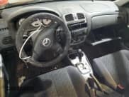 ✅ 2003 Mazda Protege • VIN: JM1BJ245131200147 • Lot: 90831995. Listed on Copart with Not provided. Free auction sales archive from the USA and detailed vehicle history report at DreamBid. Image 8.