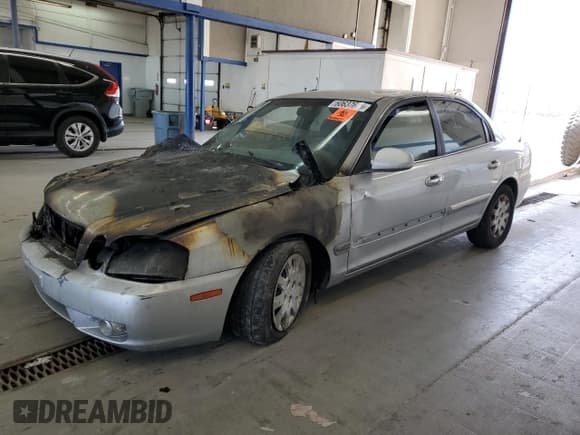 ✅ 2003 Kia Optima LX • VIN: KNAGD126335211255 • Лот: 60637665. Опубликован ранее на Copart с пробегом Не указан. Бесплатный доступ к архиву аукционных продаж из США и подробный отчёт об истории автомобиля на DreamBid. Изображение 1.