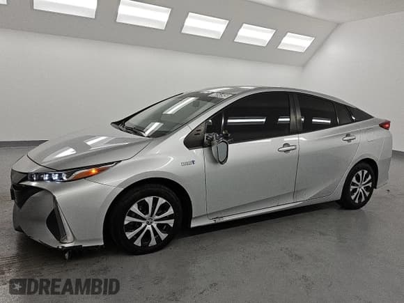 ✅ 2021 Toyota Prius LE • VIN: JTDKAMFPXM3190461 • Лот: 85264545. Опубликован ранее на Copart с пробегом 149 598 миль. Бесплатный доступ к архиву аукционных продаж из США и подробный отчёт об истории автомобиля на DreamBid. Изображение 1.