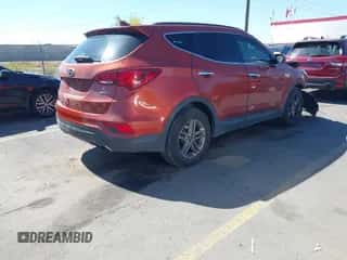 2018 Hyundai Santa Fe 2.4L z VIN 5XYZU3LB8JG523000, wystawiony jako IAAI lot #43263685 z przebiegiem 96 480 mil mil oraz . Historia ofert i sprzedaży dostępna na DreamBid. Obrazek 4.