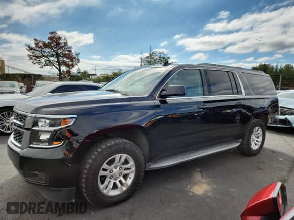 2015 Chevrolet Suburban LT with VIN 1GNSKJKC6FR660894, listed as a Copart auction lot 82732065 with 47,176 mi miles and Salvage title. Bid and sale history available at DreamBid. Image 1.