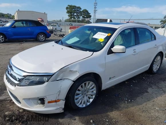 ✅ 2012 Ford Fusion Hybrid • VIN: 3FADP0L32CR371710 • Lot: 43224366. Listed on IAAI with 166,480 mi. Free auction sales archive from the USA and detailed vehicle history report at DreamBid. Image 2.