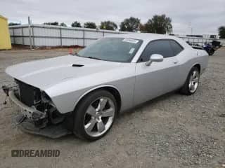 2012 Dodge Challenger SXT z VIN 2C3CDYAG8CH124761, wystawiony jako Copart lot #84588035 z przebiegiem 82 788 mil mil oraz Szkoda całkowita • Salvage title. Historia ofert i sprzedaży dostępna na DreamBid. Obrazek 1.