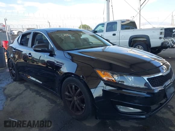 ✅ 2013 Kia Optima LX • VIN: 5XXGM4A72DG233677 • Lot: 40447041. Listed on IAAI with 124,163 mi. Free auction sales archive from the USA and detailed vehicle history report at DreamBid. Image 1.