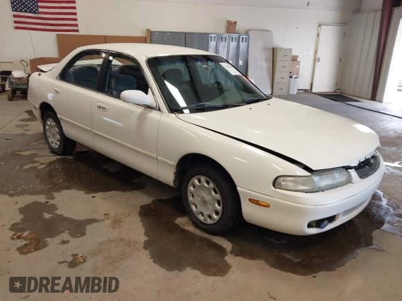 ✅ 1997 Mazda 626 DX • VIN: 1YVGE22C6V5678839 • Lot: 41265458. Wystawiony na IAAI z przebiegiem 298 926 mil. Bezpłatny archiwum sprzedaży aukcyjnych z USA i szczegółowy raport historii pojazdu na DreamBid. Zdjęcie 1.