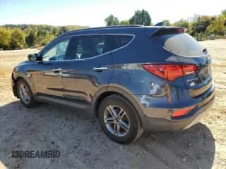 2017 Hyundai Santa Fe 2.4L z VIN 5XYZU3LB4HG388205, wystawiony jako Copart lot #82442035 z przebiegiem 95 638 mil mil oraz Szkoda całkowita • Salvage title. Historia ofert i sprzedaży dostępna na DreamBid. Obrazek 2.