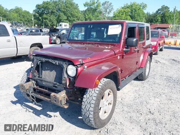 ✅ 2007 Jeep Wrangler Unlimited Sahara • VIN: 1J8GA59187L211825 • Lot: 42313099. Listed on IAAI with 107,554 mi. Free auction sales archive from the USA and detailed vehicle history report at DreamBid. Image 2.