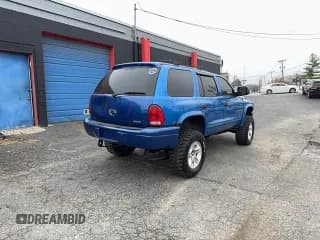 ✅ 1999 Dodge Durango • VIN: 1B4HS28Y6XF547345 • Lot: 93837545. Listed on Copart with 127,696 mi. Free auction sales archive from the USA and detailed vehicle history report at DreamBid. Image 4.