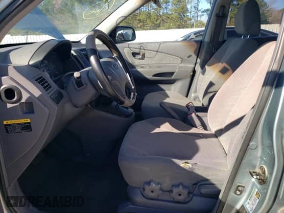 2005 Hyundai Tucson GL z VIN KM8JM12B65U184708, wystawiony jako Copart lot #73351044 z przebiegiem 209 563 mil mil oraz Szkoda całkowita • Salvage title. Historia ofert i sprzedaży dostępna na DreamBid. Obrazek 7.