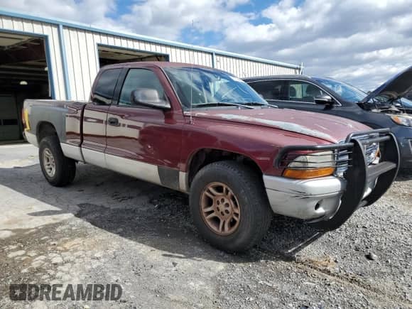 2002 Dodge Dakota с VIN 1B7GG42X12S660969, выставлен на аукционе Copart как лот 87199465 с пробегом 198 880 миль миль и Списание • Salvage title. История ставок и продаж доступна на DreamBid. Изображение 4.