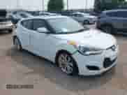 2012 Hyundai Veloster w/Gray Int with VIN KMHTC6AD3CU051395, listed as a IAAI auction lot 42489038 with 153,319 mi miles and . Bid and sale history available at DreamBid. Image 1.