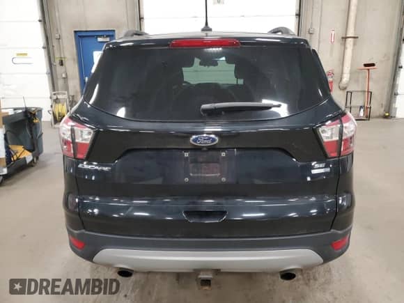 2018 Ford Escape SE z VIN 1FMCU9GD5JUA85387, wystawiony jako Copart lot #91200335 z przebiegiem 142 271 mil mil oraz Szkoda całkowita • Salvage title. Historia ofert i sprzedaży dostępna na DreamBid. Obrazek 6.