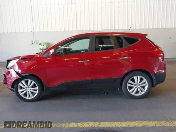 2010 Hyundai Tucson GLS with VIN KM8JUCAC5AU103469, listed as a IAAI auction lot 43394997 with 123,949 mi miles and . Bid and sale history available at DreamBid. Image 14.