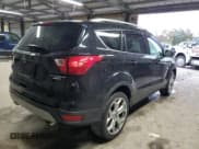 ✅ 2019 Ford Escape Titanium • VIN: 1FMCU9J9XKUC23625 • Lot: 90049675. Listed on Copart with 101,272 mi. Free auction sales archive from the USA and detailed vehicle history report at DreamBid. Image 3.
