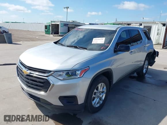 ✅ 2020 Chevrolet Traverse LS • VIN: 1GNERFKW1LJ250465 • Lot: 43244251. Listed on IAAI with 124,464 mi. Free auction sales archive from the USA and detailed vehicle history report at DreamBid. Image 2.