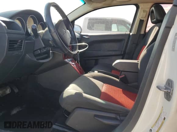 2008 Dodge Caliber SXT с VIN 1B3HB48B18D679860, выставлен на аукционе Copart как лот 71800004 с пробегом 165 882 миль миль и Списание • Salvage title. История ставок и продаж доступна на DreamBid. Изображение 7.