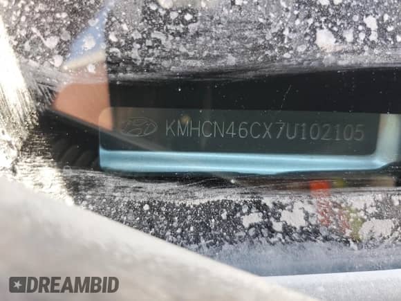 2007 Hyundai Accent GLS z VIN KMHCN46CX7U102105, wystawiony jako Copart lot #65793504 z przebiegiem 213 972 mil mil oraz Szkoda całkowita • Salvage title. Historia ofert i sprzedaży dostępna na DreamBid. Obrazek 13.